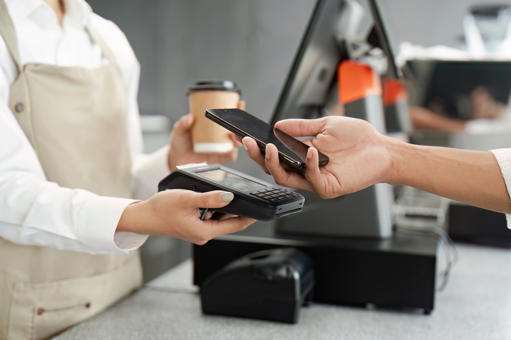 Contactless Payment Transaction at Coffee Shop with Smartphone and POS Terminal